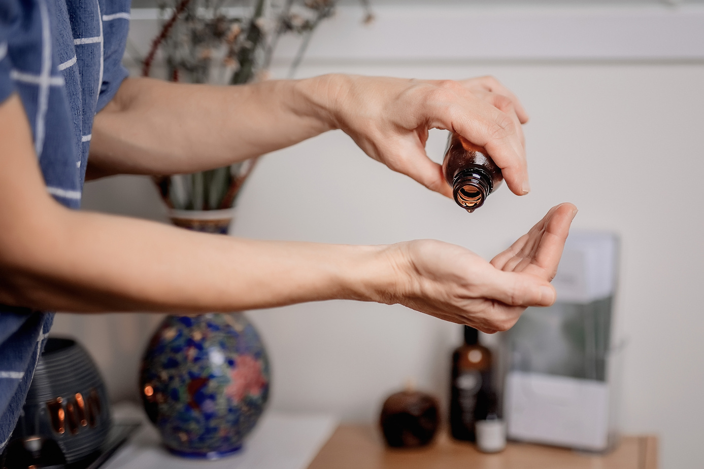 Woman Drops Essential Oil on Her Palm